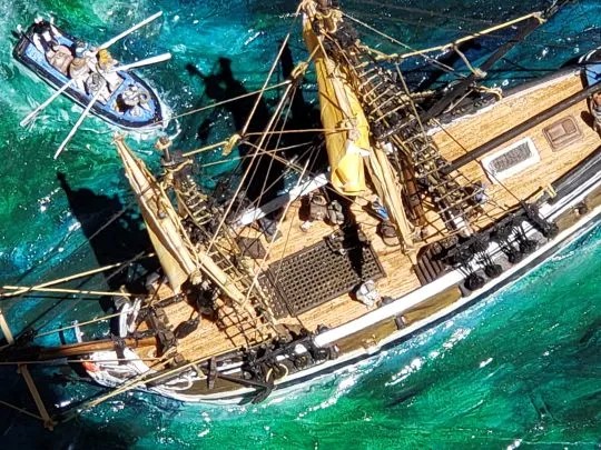 An overhead shot of the heavily modified Aurora Black Falcon ship, showing the popsicle-stick decks.