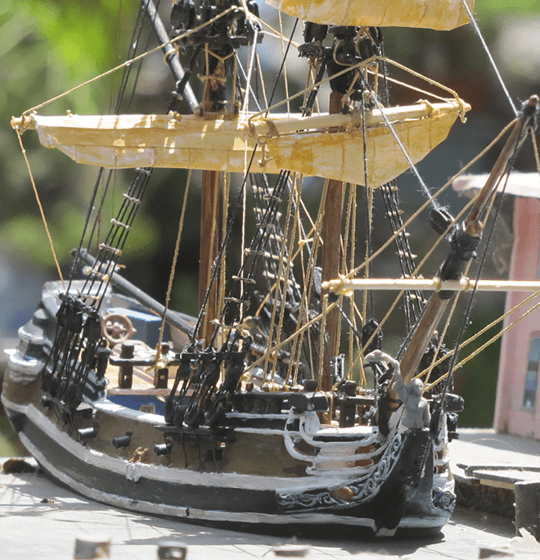 A view over the starboard bow of the heavily modified Aurora Black Falcon model ship, showing the paper sail technique.