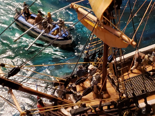 A view of the ship's boat seen through the foremast rigging of the heavily modified Aurora Black Falcon model ship kit.